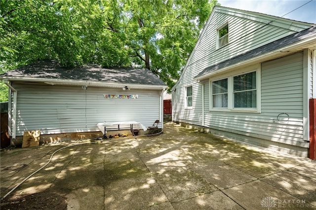3521 E 4th St, Dayton, OH 45403 - view of side of property featuring a patio area and a shingled roof