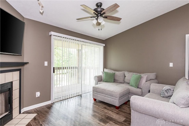 6600 Green Branch Dr Unit 5, Dayton, OH 45459 - living area featuring a tile fireplace, wood finished floors, and a ceiling fan