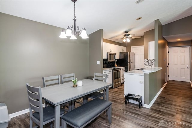 6600 Green Branch Dr Unit 5, Dayton, OH 45459 - dining room featuring dark wood finished floors, a chandelier, ceiling fan, and vaulted ceiling