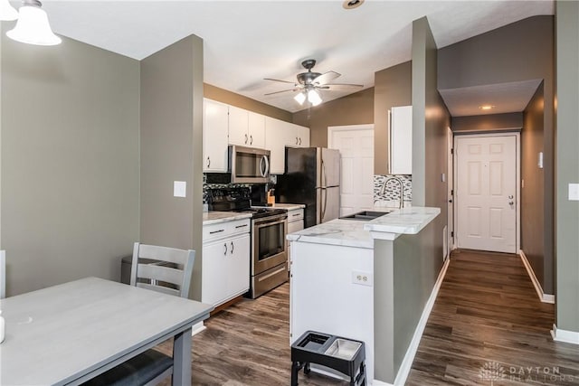 6600 Green Branch Dr Unit 5, Dayton, OH 45459 - kitchen with stainless steel appliances, backsplash, dark wood-style floors, ceiling fan, and lofted ceiling