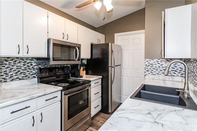 6600 Green Branch Dr Unit 5, Dayton, OH 45459 - kitchen with appliances with stainless steel finishes, ceiling fan, white cabinetry, tasteful backsplash, and lofted ceiling