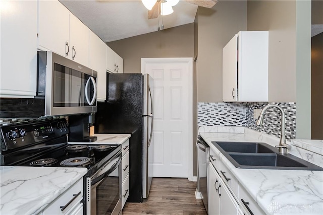 6600 Green Branch Dr Unit 5, Dayton, OH 45459 - kitchen with appliances with stainless steel finishes, vaulted ceiling, white cabinetry, wood finished floors, and a ceiling fan
