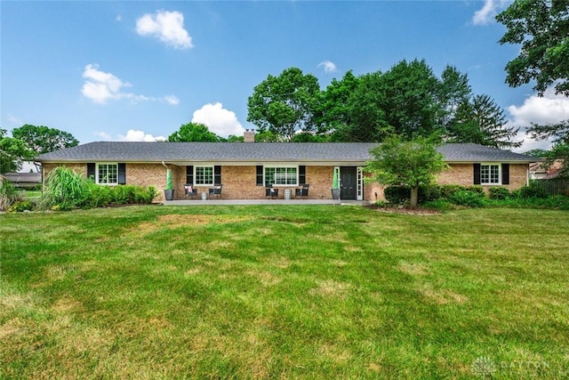 1695 Winterstone Ct, Washington Twp, OH 45458 - ranch-style house featuring a front yard, a chimney, and brick siding