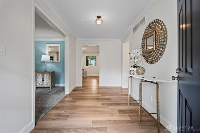 1695 Winterstone Ct, Washington Twp, OH 45458 - hallway featuring crown molding and light wood-style flooring