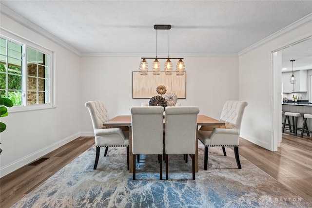 1695 Winterstone Ct, Washington Twp, OH 45458 - dining space with wood finished floors and crown molding