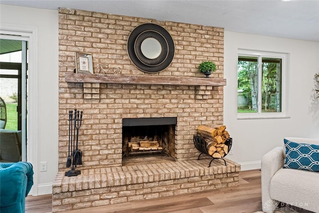 1695 Winterstone Ct, Washington Twp, OH 45458 - living area featuring wood finished floors and a fireplace