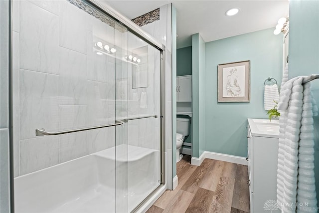 1695 Winterstone Ct, Washington Twp, OH 45458 - bathroom featuring vanity, a shower with shower door, and wood finished floors