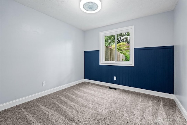 1695 Winterstone Ct, Washington Twp, OH 45458 - carpeted empty room with a wainscoted wall and baseboards