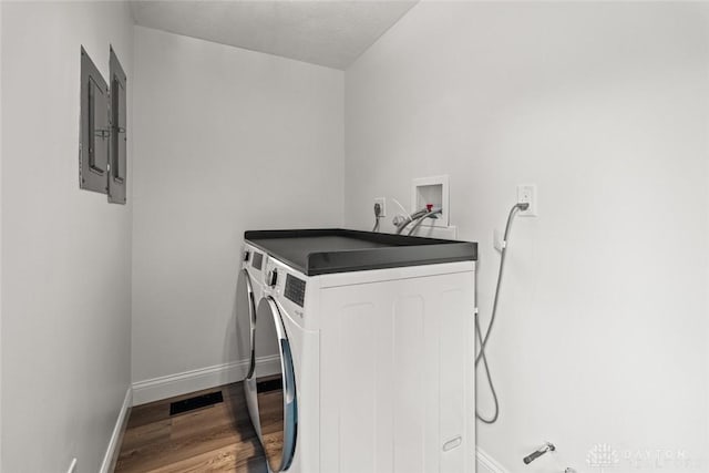 1695 Winterstone Ct, Washington Twp, OH 45458 - laundry room featuring washing machine and clothes dryer and wood finished floors