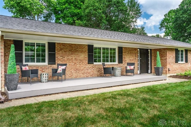 1695 Winterstone Ct, Washington Twp, OH 45458 - back of house featuring brick siding, a yard, and covered porch