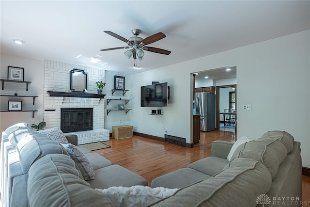 1908 Court Donegal, Middletown, OH 45042 - living area featuring a ceiling fan, wood finished floors, recessed lighting, and a brick fireplace