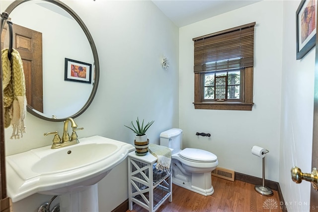 1908 Court Donegal, Middletown, OH 45042 - half bath featuring toilet and wood finished floors