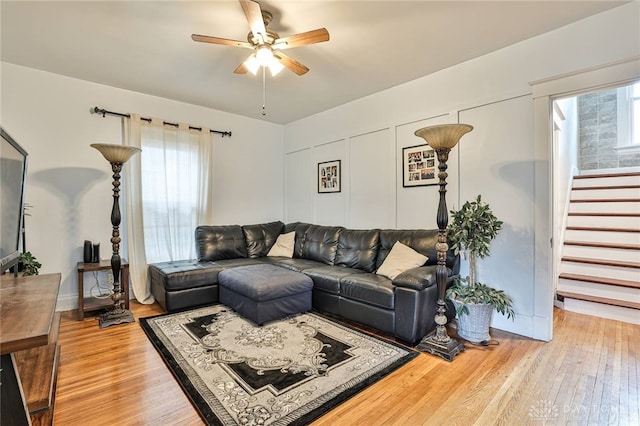 15 Harrison St, Middletown, OH 45042 - living area with ceiling fan, light wood-style flooring, and stairway