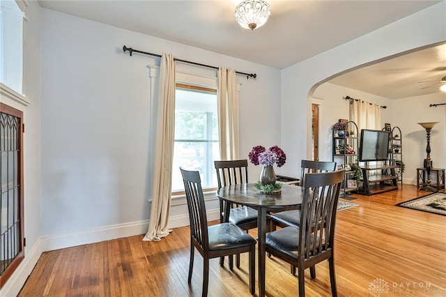 15 Harrison St, Middletown, OH 45042 - dining room featuring arched walkways, light wood-style flooring, and a ceiling fan