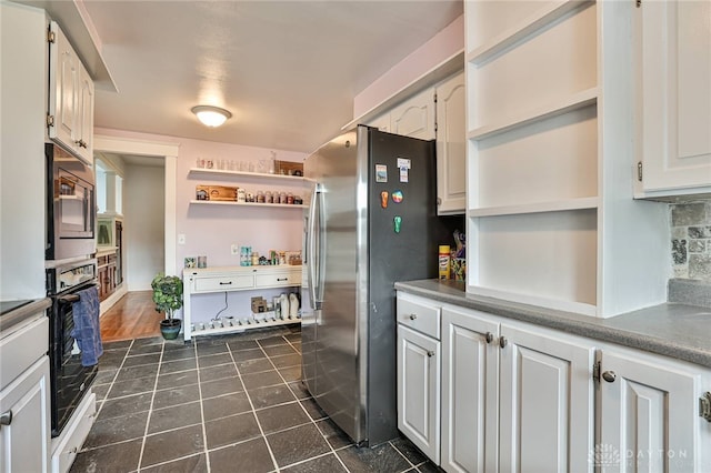 15 Harrison St, Middletown, OH 45042 - kitchen with open shelves, appliances with stainless steel finishes, white cabinets, dark tile patterned floors, and backsplash