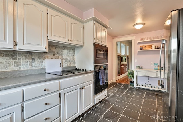 15 Harrison St, Middletown, OH 45042 - kitchen featuring black appliances, dark tile patterned flooring, tasteful backsplash, open shelves, and white cabinetry