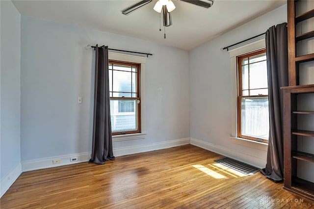 15 Harrison St, Middletown, OH 45042 - unfurnished room with light wood finished floors, plenty of natural light, and ceiling fan