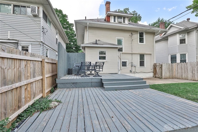 15 Harrison St, Middletown, OH 45042 - back of property featuring a wooden deck, a fenced backyard, and a chimney