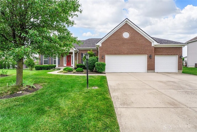 2073 Lincolnshire Dr, Beavercreek, OH 45434 - view of front of property with concrete driveway, a front yard, a garage, and brick siding