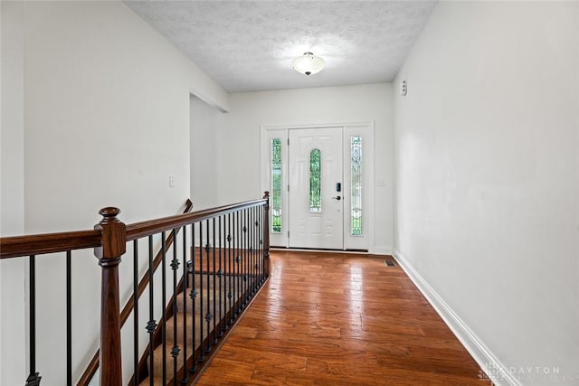 2073 Lincolnshire Dr, Beavercreek, OH 45434 - entryway featuring wood finished floors and a textured ceiling