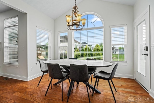 2073 Lincolnshire Dr, Beavercreek, OH 45434 - dining room featuring a chandelier, wood finished floors, healthy amount of natural light, and vaulted ceiling