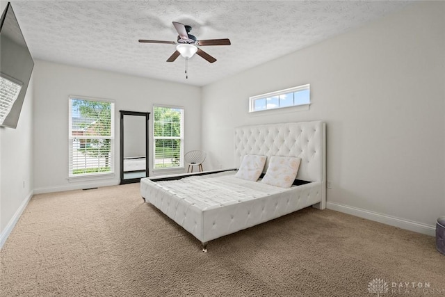 2073 Lincolnshire Dr, Beavercreek, OH 45434 - carpeted bedroom with a textured ceiling and a ceiling fan