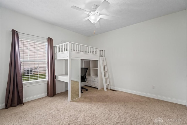 2073 Lincolnshire Dr, Beavercreek, OH 45434 - unfurnished bedroom featuring carpet flooring, an office area, and a ceiling fan