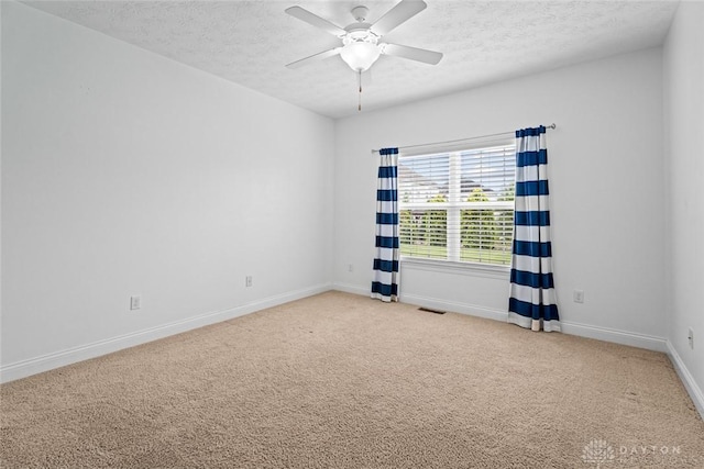 2073 Lincolnshire Dr, Beavercreek, OH 45434 - empty room featuring a textured ceiling, light carpet, and a ceiling fan