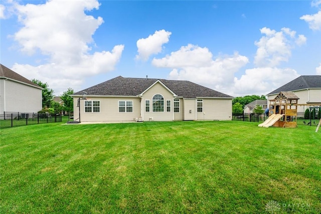 2073 Lincolnshire Dr, Beavercreek, OH 45434 - rear view of house with a fenced backyard and a playground