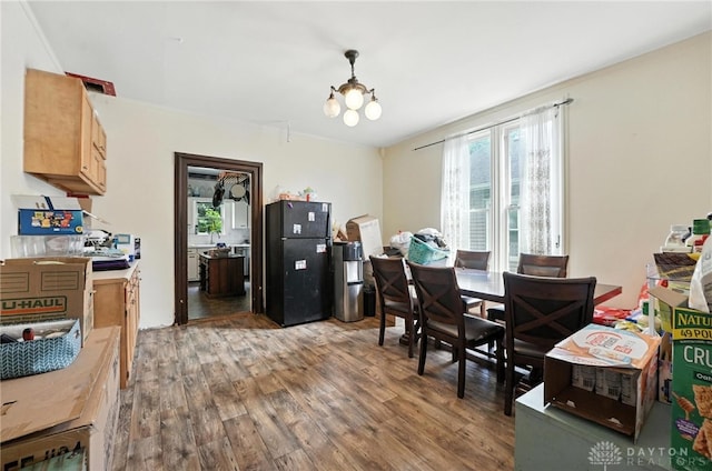116 Elm St, Franklin, OH 45005 - dining space with wood finished floors, plenty of natural light, and a chandelier