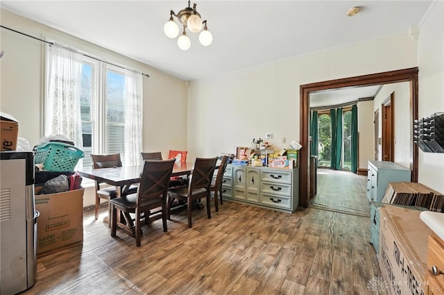 116 Elm St, Franklin, OH 45005 - dining space with wood finished floors, healthy amount of natural light, and a chandelier
