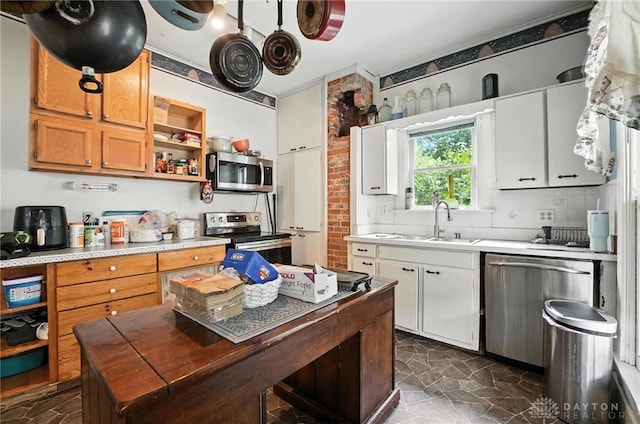 116 Elm St, Franklin, OH 45005 - kitchen with appliances with stainless steel finishes, open shelves, light countertops, and dark stone finish floors