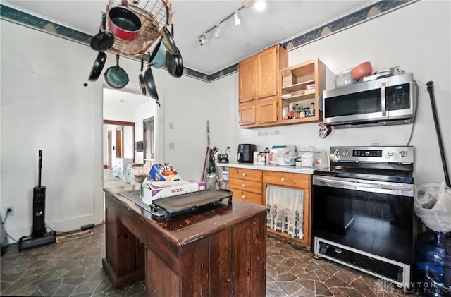 116 Elm St, Franklin, OH 45005 - kitchen featuring stainless steel appliances, dark stone finish floors, light countertops, and open shelves