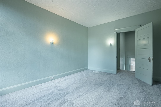 19 Mckinley St, Middletown, OH 45042 - carpeted spare room featuring baseboards and a textured ceiling