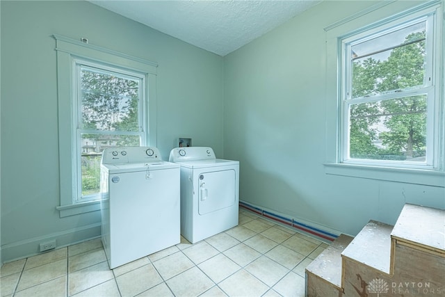 19 Mckinley St, Middletown, OH 45042 - laundry area featuring washer and dryer, light tile patterned floors, and a textured ceiling