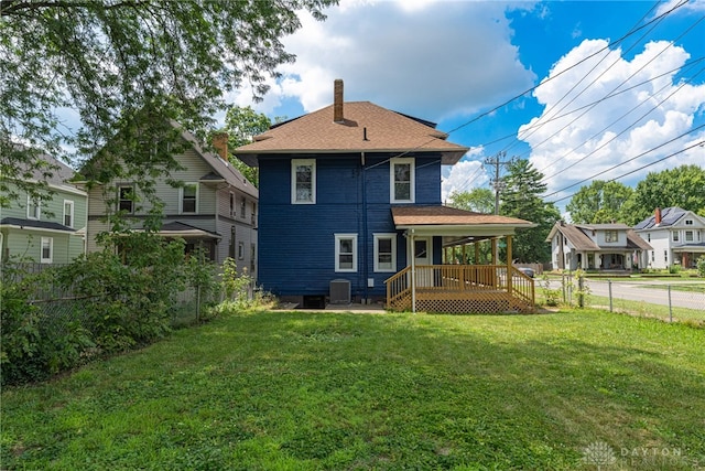 19 Mckinley St, Middletown, OH 45042 - back of house featuring a fenced backyard, a chimney, and covered porch