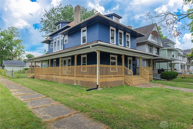 19 Mckinley St, Middletown, OH 45042 - view of front of property featuring covered porch, a chimney, and a front yard