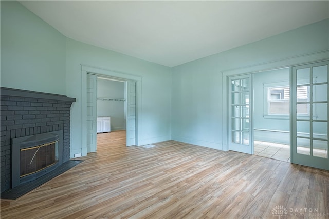19 Mckinley St, Middletown, OH 45042 - unfurnished living room with wood finished floors and a fireplace