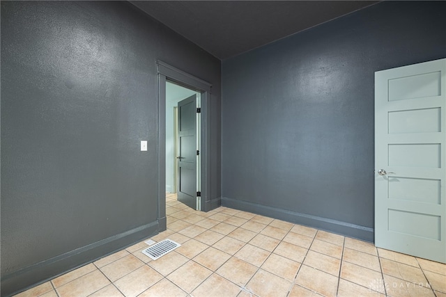 19 Mckinley St, Middletown, OH 45042 - empty room with light tile patterned floors and a textured wall