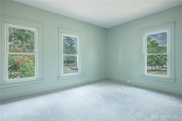 19 Mckinley St, Middletown, OH 45042 - carpeted empty room with healthy amount of natural light