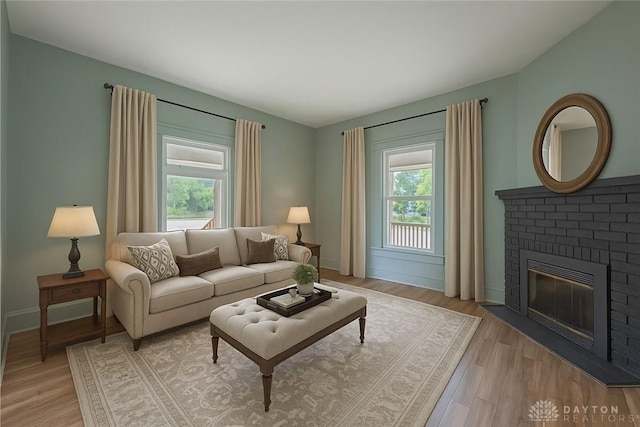 19 Mckinley St, Middletown, OH 45042 - living area with plenty of natural light, a fireplace, and light wood finished floors