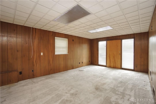 702 W Sharon Rd, Forest Park, OH 45240 - empty room featuring carpet floors, a paneled ceiling, and wood walls