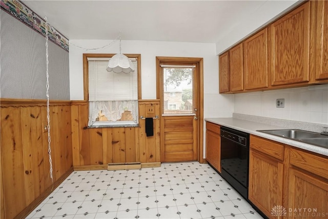 702 W Sharon Rd, Forest Park, OH 45240 - kitchen featuring dishwasher, light floors, a wainscoted wall, brown cabinets, and light countertops
