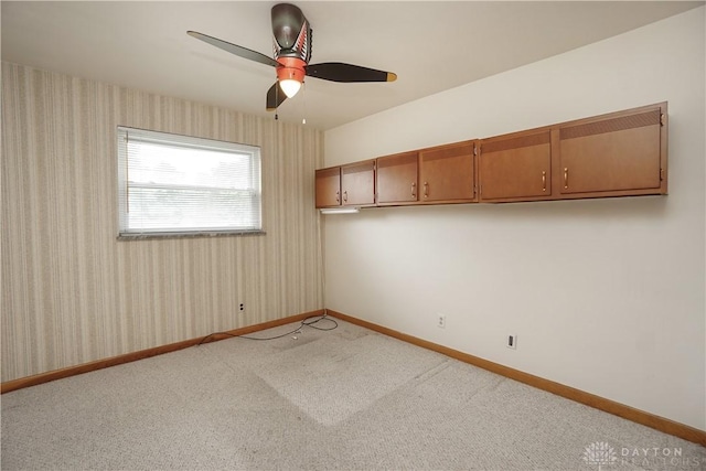 702 W Sharon Rd, Forest Park, OH 45240 - carpeted spare room with a ceiling fan and wallpapered walls