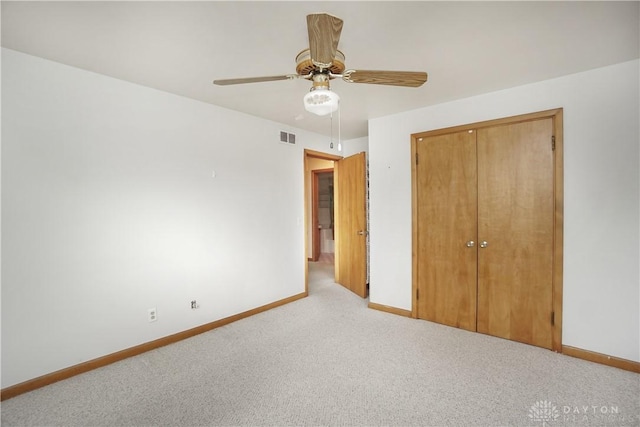 702 W Sharon Rd, Forest Park, OH 45240 - unfurnished bedroom with carpet floors, a closet, and ceiling fan