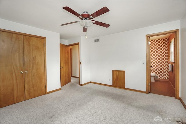 702 W Sharon Rd, Forest Park, OH 45240 - unfurnished bedroom featuring light carpet, a closet, ensuite bathroom, and a ceiling fan