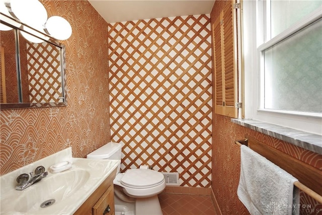 702 W Sharon Rd, Forest Park, OH 45240 - half bathroom featuring wallpapered walls, vanity, and tile patterned floors