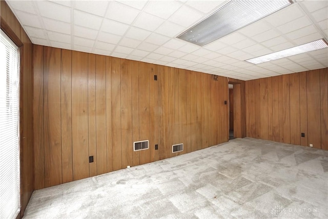 702 W Sharon Rd, Forest Park, OH 45240 - carpeted empty room with wood walls