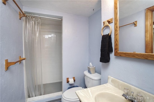 702 W Sharon Rd, Forest Park, OH 45240 - bathroom featuring toilet and a shower stall