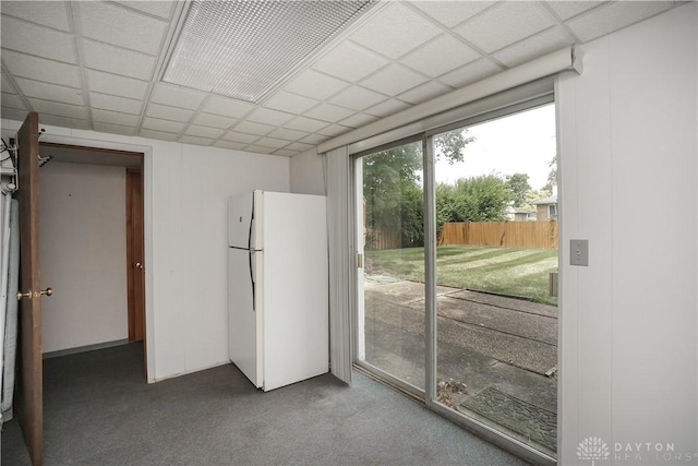 702 W Sharon Rd, Forest Park, OH 45240 - unfurnished bedroom with freestanding refrigerator, access to outside, carpet, and a paneled ceiling